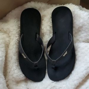 Black reef flip flops